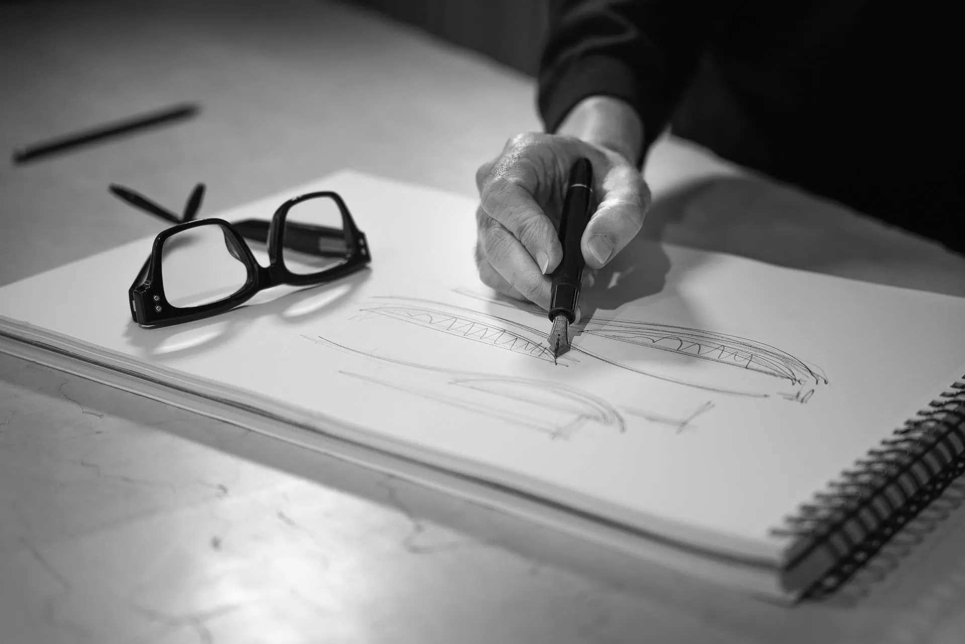 manuel ruiz moriche's hand sketching with fountain pen on notebook, intuitive creative process at ARK Architects