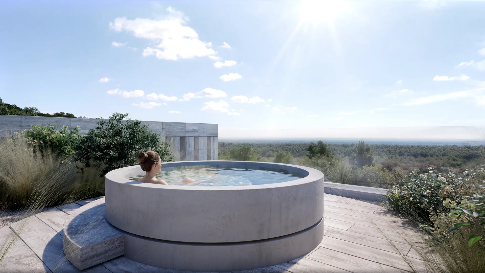 Una mujer disfrutando de un jacuzzi en el jardín exterior, con vistas al mar. El proyecto NARA, de Manuel Ruiz ARK Architects
