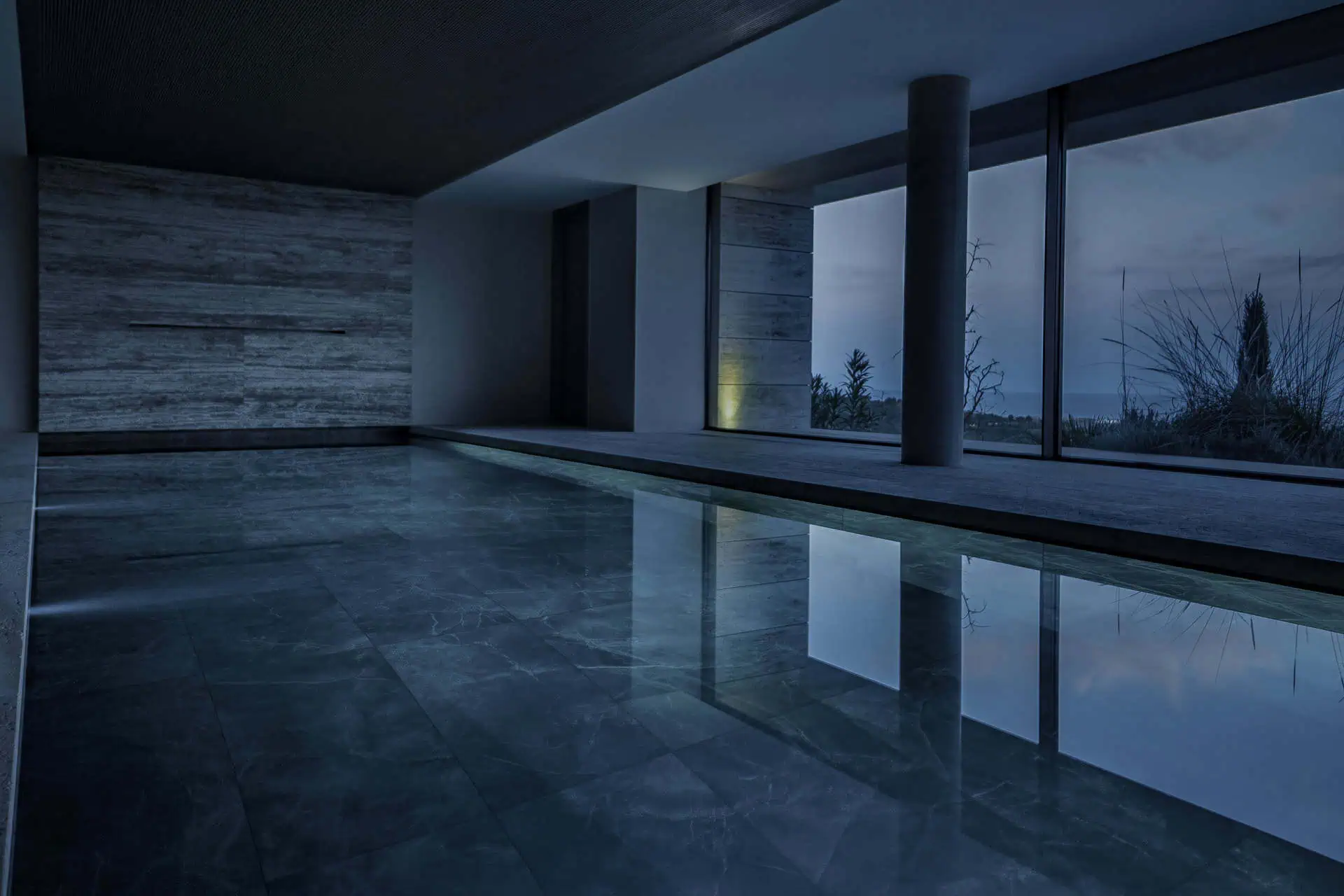 Outdoor pool at dusk with travertine cladding, Sanctuary project by ARK Architects