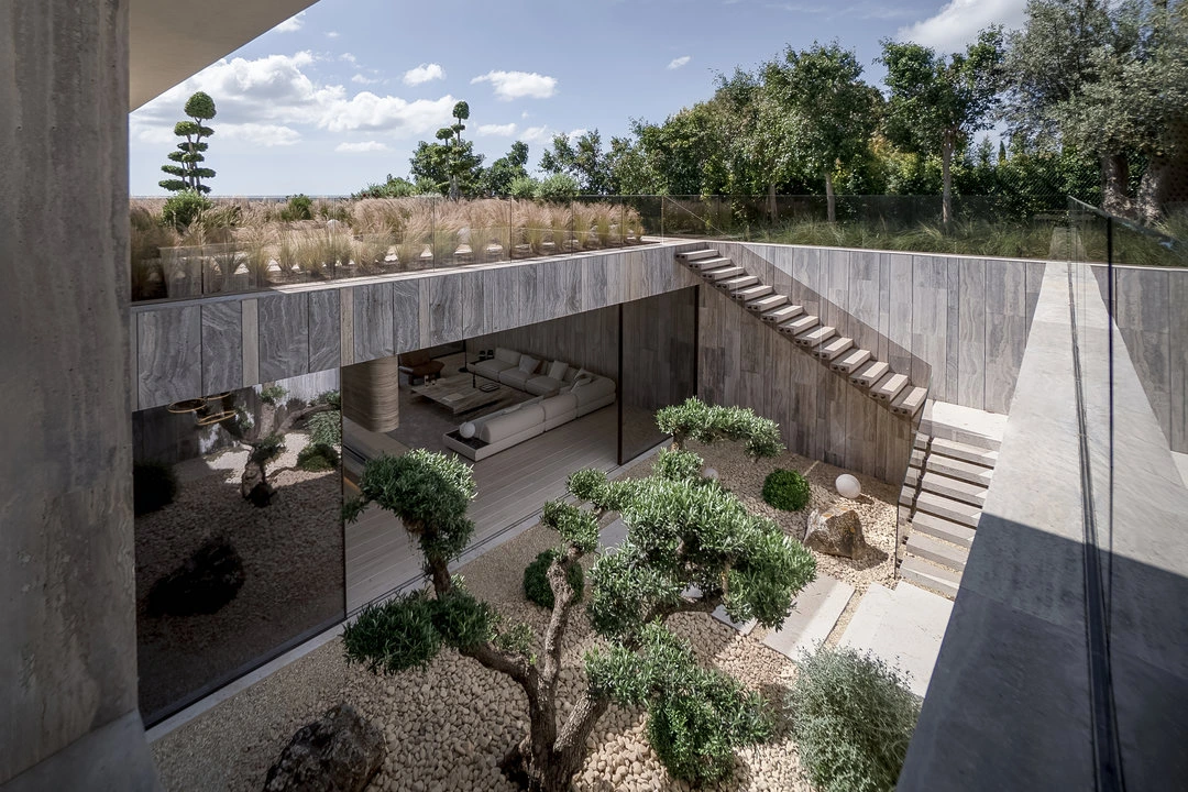 Interior terrace with garden and stairs in villa ENSO
