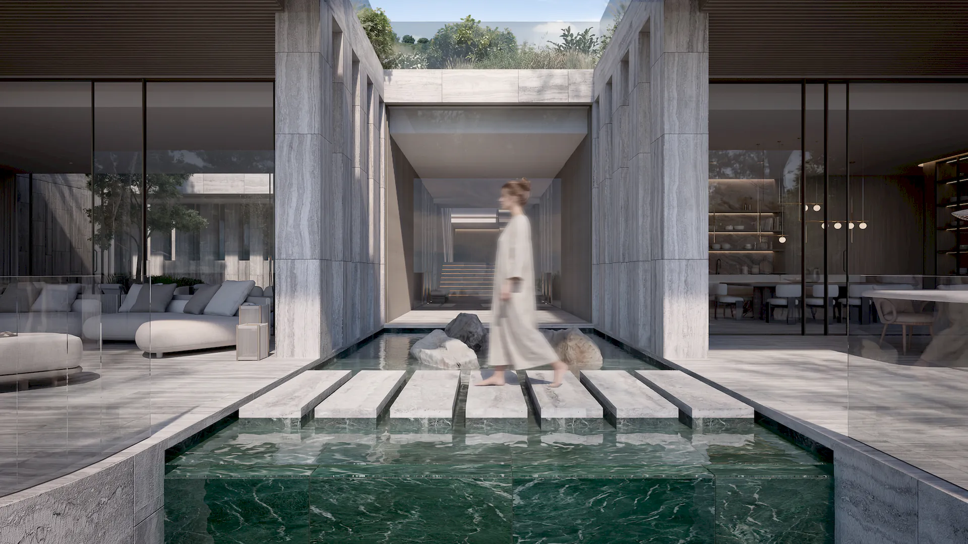 A stone walkway over water features connecting the fluid living spaces of Villa DUNE, a sensory design by Manuel Ruiz Moriche, ARK Architects.